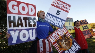 Reuters. Nov. 11, 2010: Members of the Westboro Baptist Church hold anti-gay signs at Arlington National Cemetery in Virginia on Veterans Day.