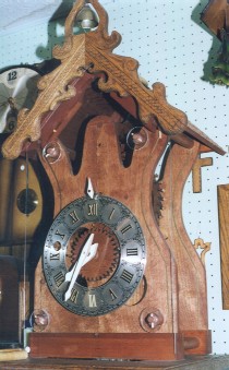 Another hand-carved wooden clock displayed for enjoyment, not for sale.