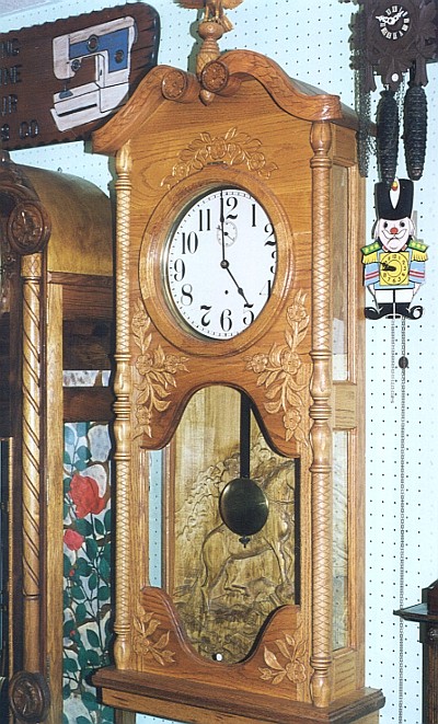 Hand-carved wooden clocks: some of the hundreds on display for enjoyment, not for sale.