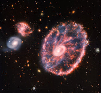NASA, ESA, CSA, STScI and Webb ERO Production Team's image from the James Webb Space Telescope. The Cartwheel galaxy group: Cartwheel Galaxy (ESO 350-40 / PGC 2248 / 2MASX J00374110-3342587 / ...) and smaller associated galaxies. Data from Near-Infrared Camera (NIRCam) and Mid-Infrared Instrument (MIRI) (released August 2, 2022 by NASA)