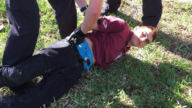 Police photo (probably the Coconut Creek Police Department): Police arresting Nikolas J. Cruz in Florida, following the Stoneman Douglas High School shooting. (February 14, 2018)