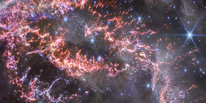 Detail. JWST (NASA, ESA, CSA, STScI, D. Milisavljevic (Purdue University), T. Temim (Princeton University), I. De Looze (University of Gent))'s NIRCam image: Cassiopeia A (Cas A) in in near-infrared light. Red, green, and blue were assigned to 4.4, 3.56, and 1.62 microns. (image released December 10, 2023)
