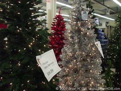 Pre-lit red, white, and green Christmas trees in Sauk Centre, Minnesota