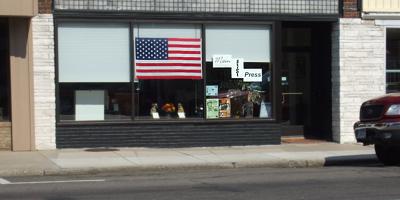 Flag in the window in Sauk Centre, Minnesota