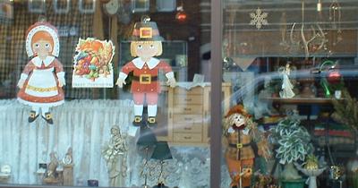 Thanksgiving and Christmas decorations, a scarecrow and antlers in Sauk Centre