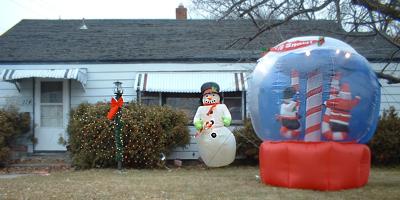 A yard with the new inflatable snow globe