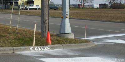 Mysterious message on curb, Sauk Centre, Minnesota