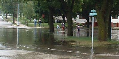 Kids, bikes, and a flooded street